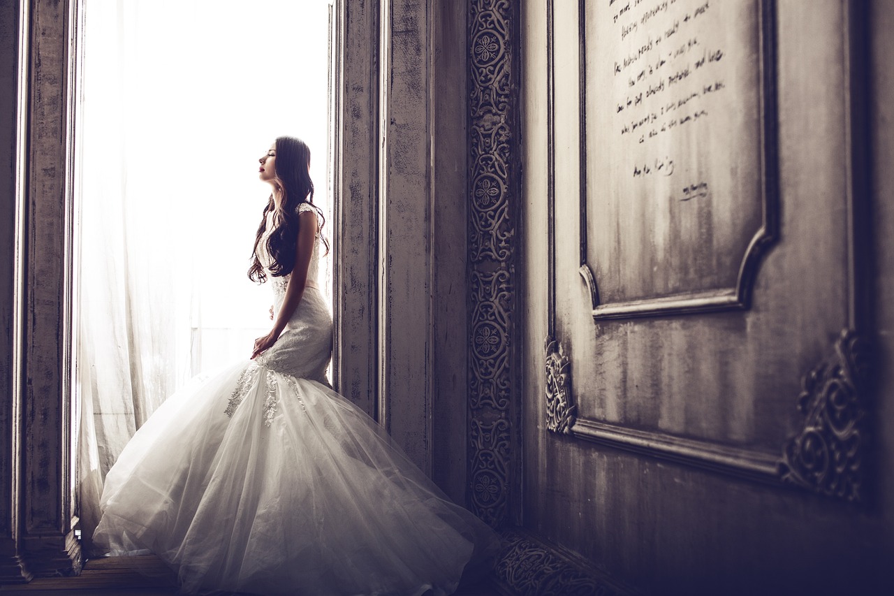 wedding-dresses-1486005_1280 a woman talking on a cell phone